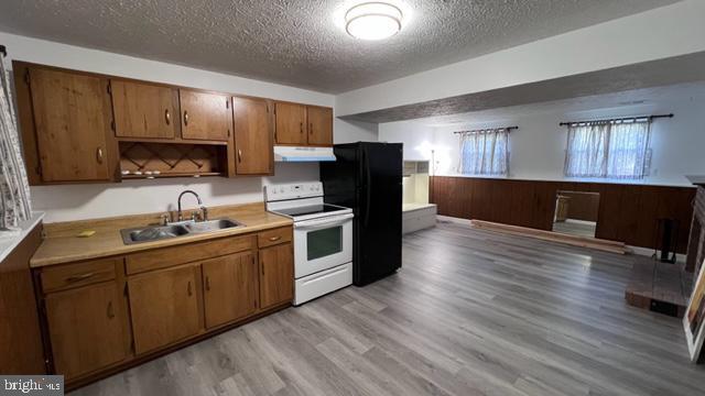 1314 Hillcrest Drive Frederick, MD 21703 - Photo 8 of 11 a kitchen with stainless steel appliances a refrigerator sink and wooden cabinets