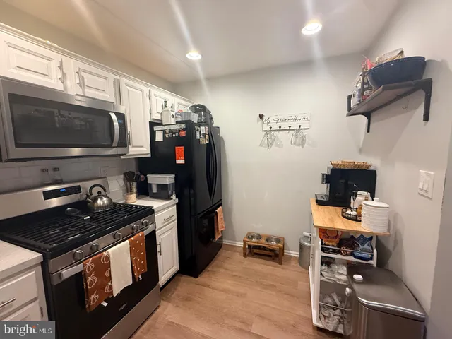 a kitchen with a stove and a microwave