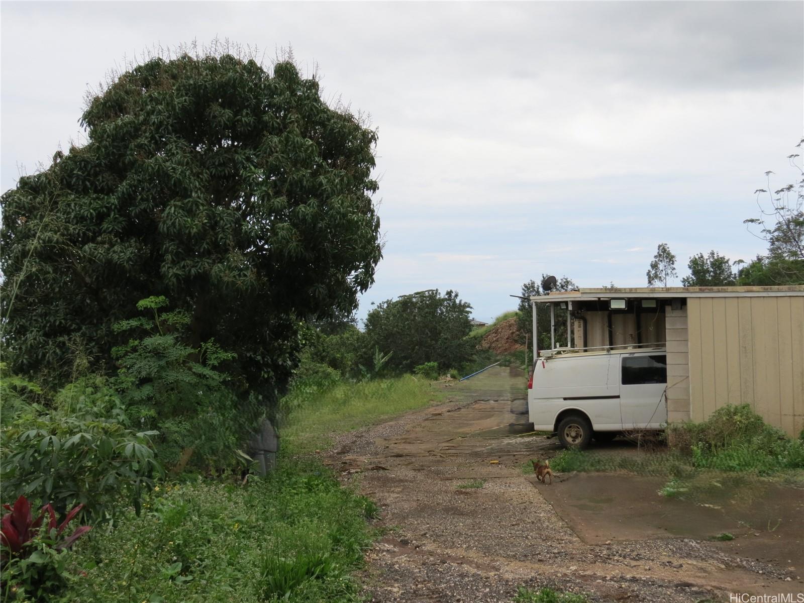 94-1100 Kunia Road, Unit 42F Waipahu, HI 96797 - Photo 25 of 25 an outdoor view of a house with backyard