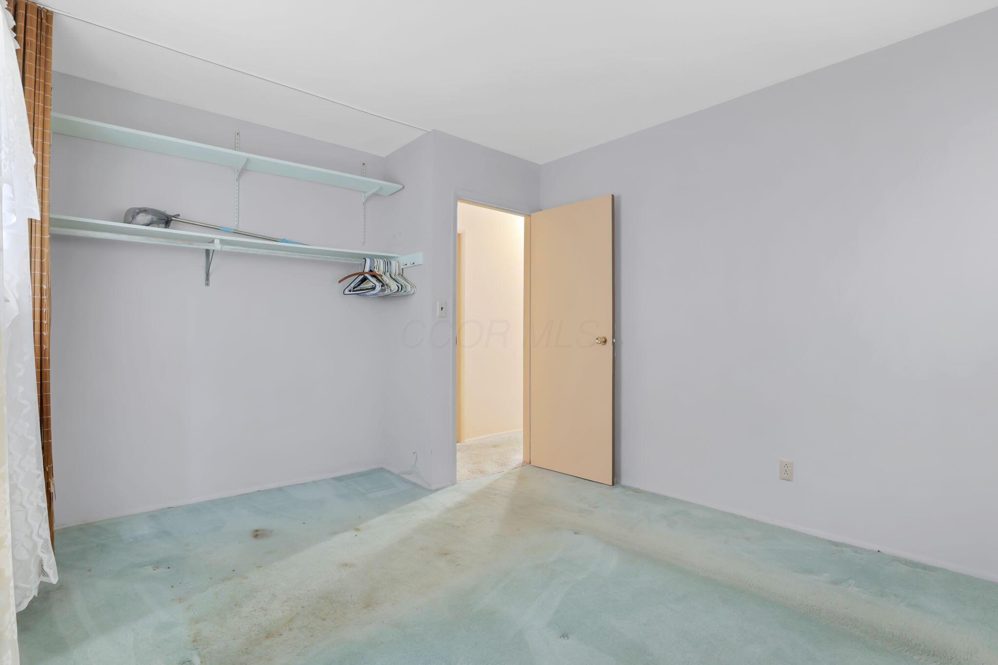 3882 Glenfield Road Columbus, OH 43232 - Photo 20 of 29 Room featuring light-colored walls and wall-to-wall carpeting