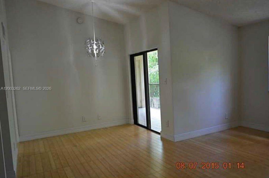 620 South Park Road, Unit 312 Hollywood, FL 33021 - Photo 2 of 14 an empty room with wooden floor and windows