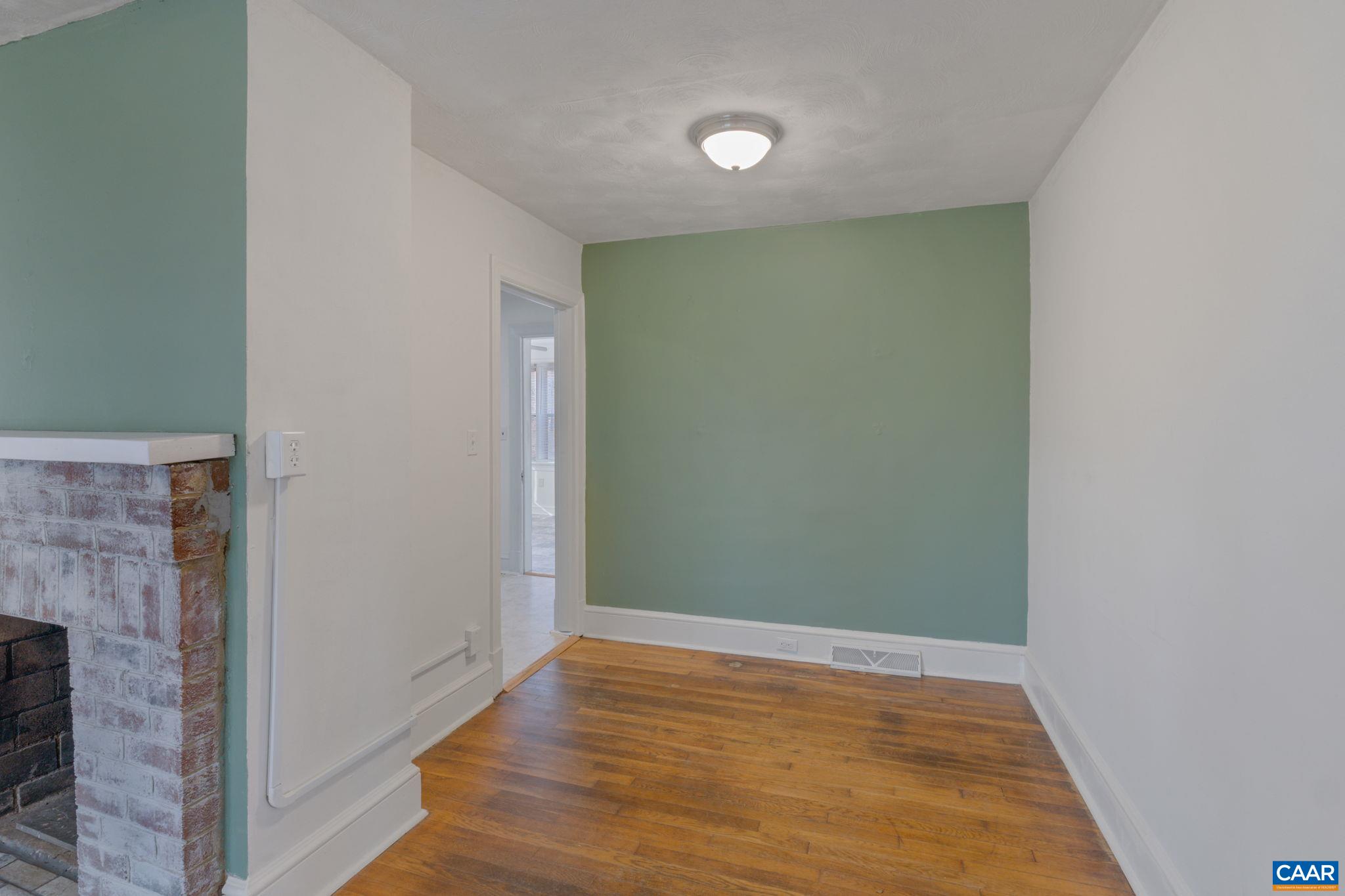 371 Fanny White Road Buckingham, VA 23921 - Photo 8 of 43 a view of an empty room with wooden floor