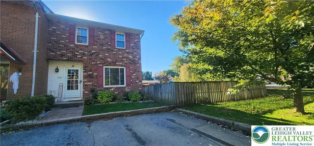 front view of a house with a garden