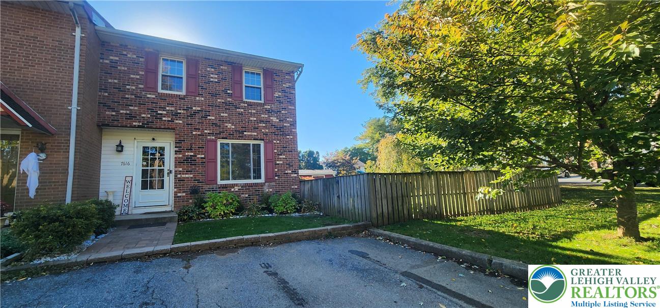 front view of a house with a garden