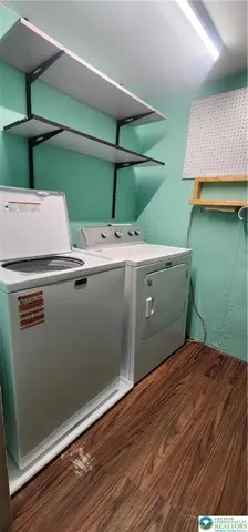 a view of room with washer and dryer