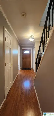 a view of entryway with wooden floor