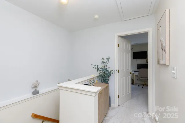 a bedroom with a bed and ceiling fan