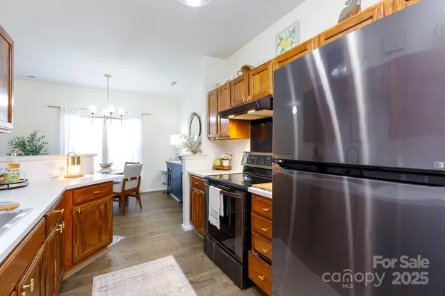 a kitchen with a sink and a stove top oven
