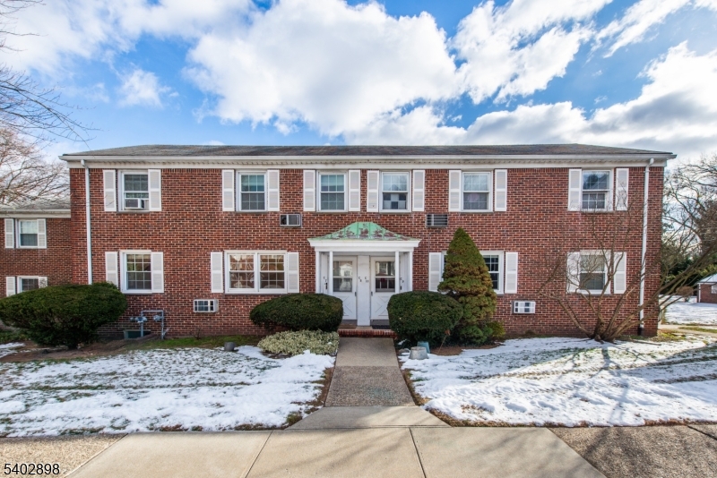 445 Morris Avenue, Unit 7 Springfield, NJ 07081 - Photo 15 of 16 a front view of a house with garden