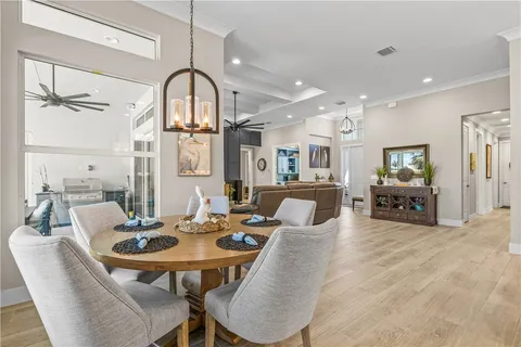 a living room with furniture ceiling fan and a rug