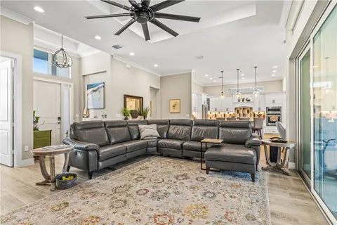 a view of a patio with table and chairs under an umbrella