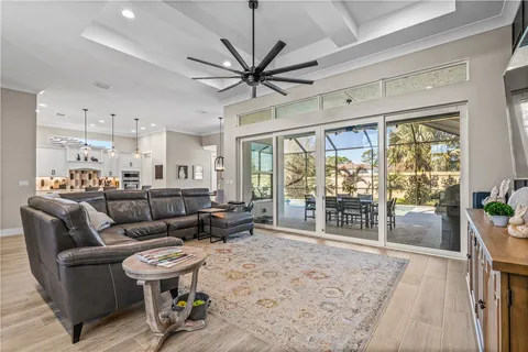 a spacious bedroom with a large bed and a dresser