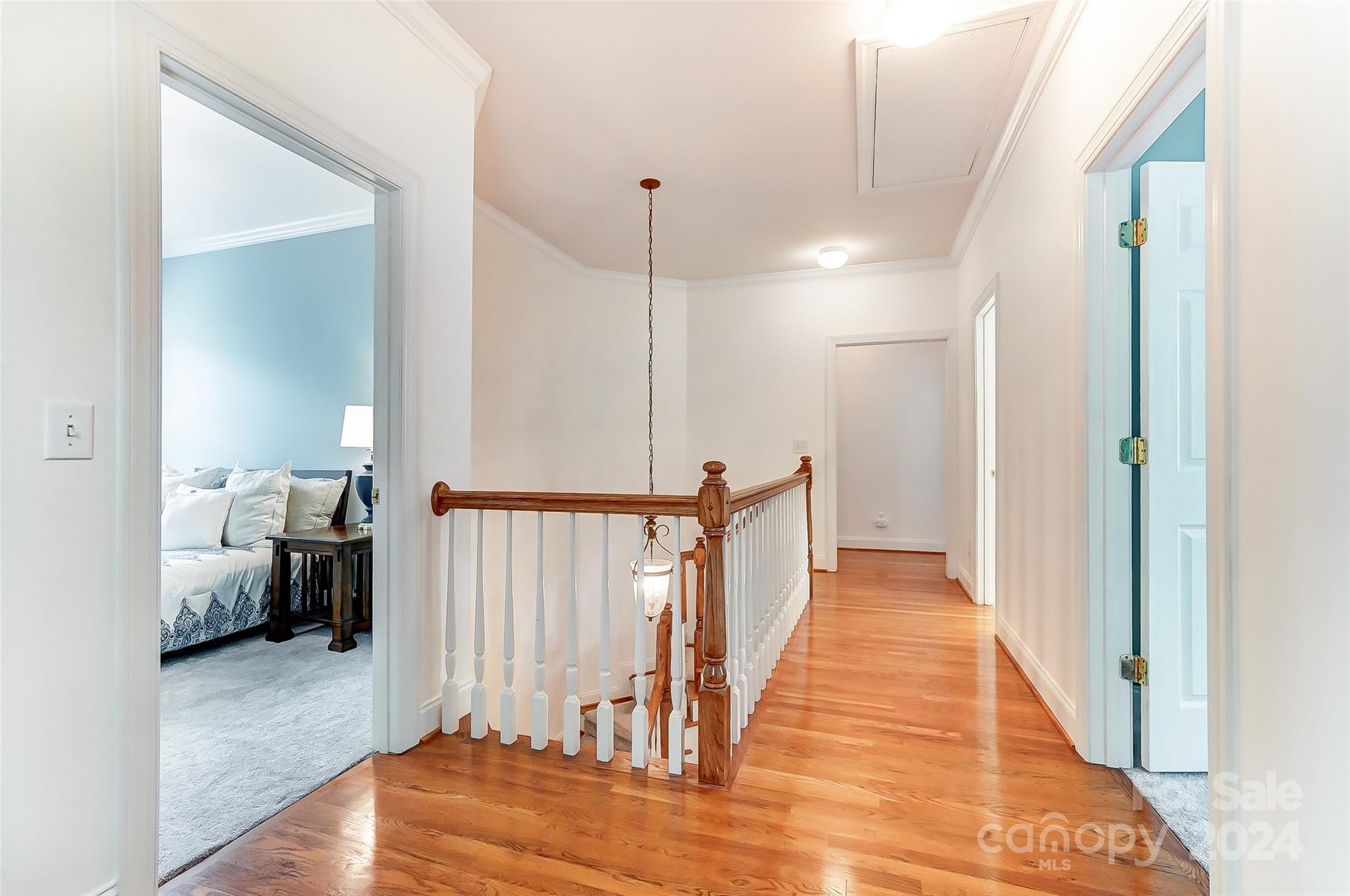 412 Sophia Court Fort Mill, SC 29708 - Photo 15 of 34 a view of a hallway with wooden floor and staircase