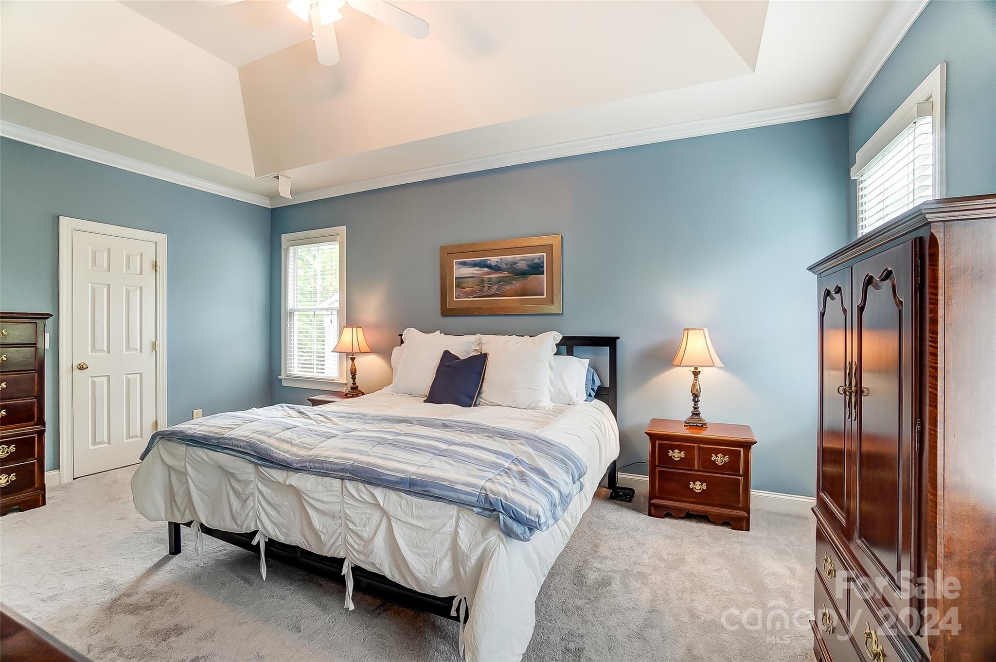 412 Sophia Court Fort Mill, SC 29708 - Photo 17 of 34 a bedroom with a bed and a lamp on dresser