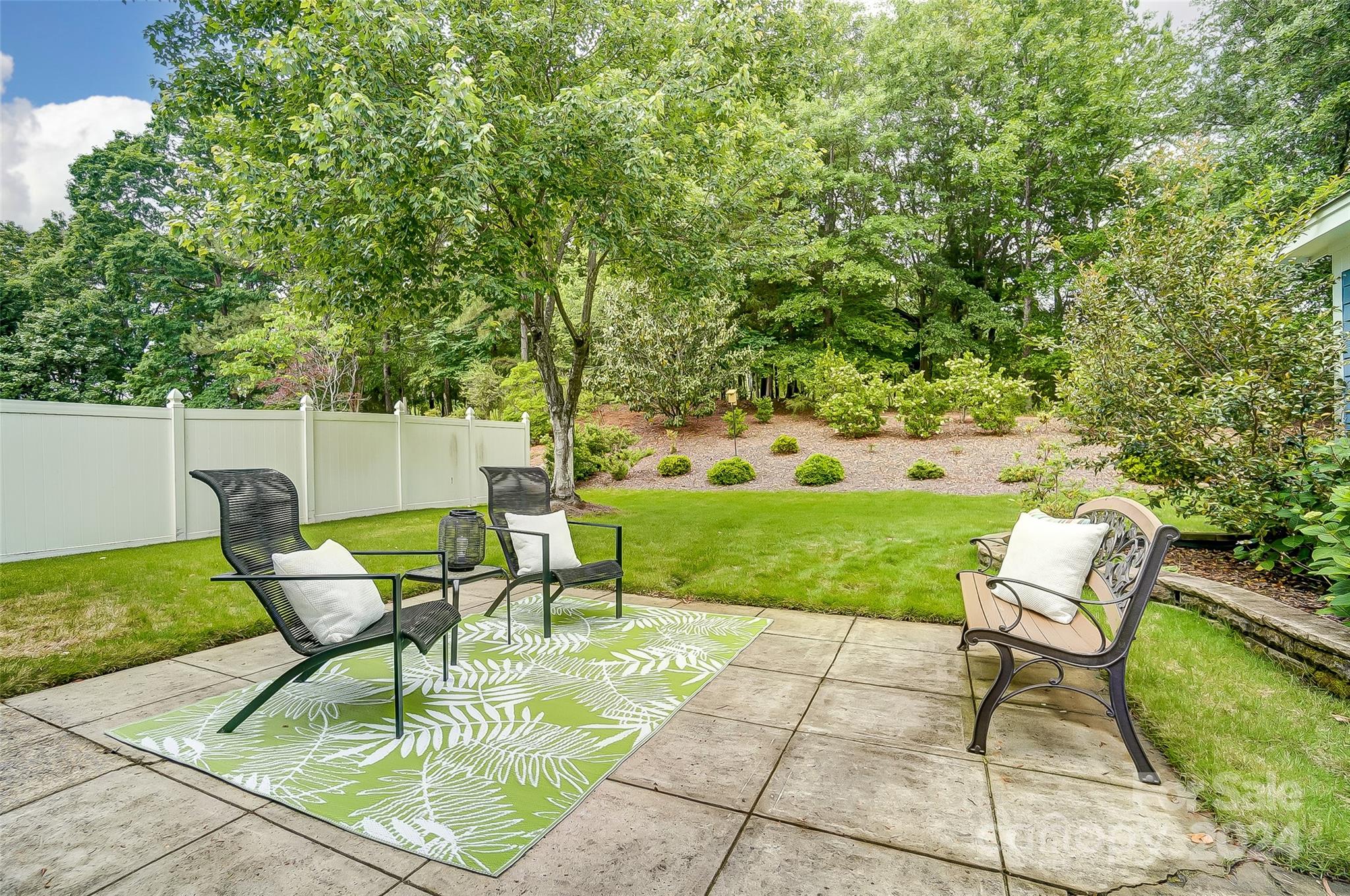 412 Sophia Court Fort Mill, SC 29708 - Photo 28 of 34 a view of a chairs and table in backyard of the house