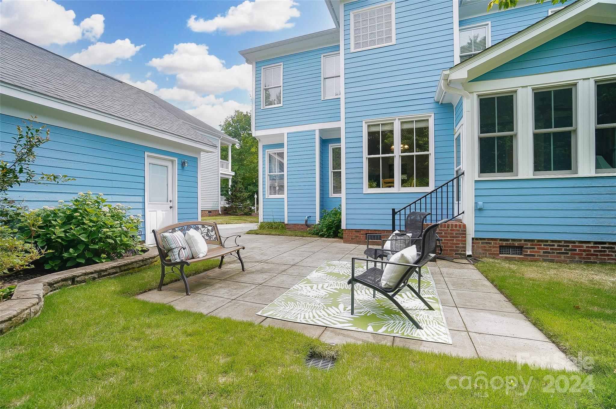 412 Sophia Court Fort Mill, SC 29708 - Photo 29 of 34 a house view with a seating space and garden