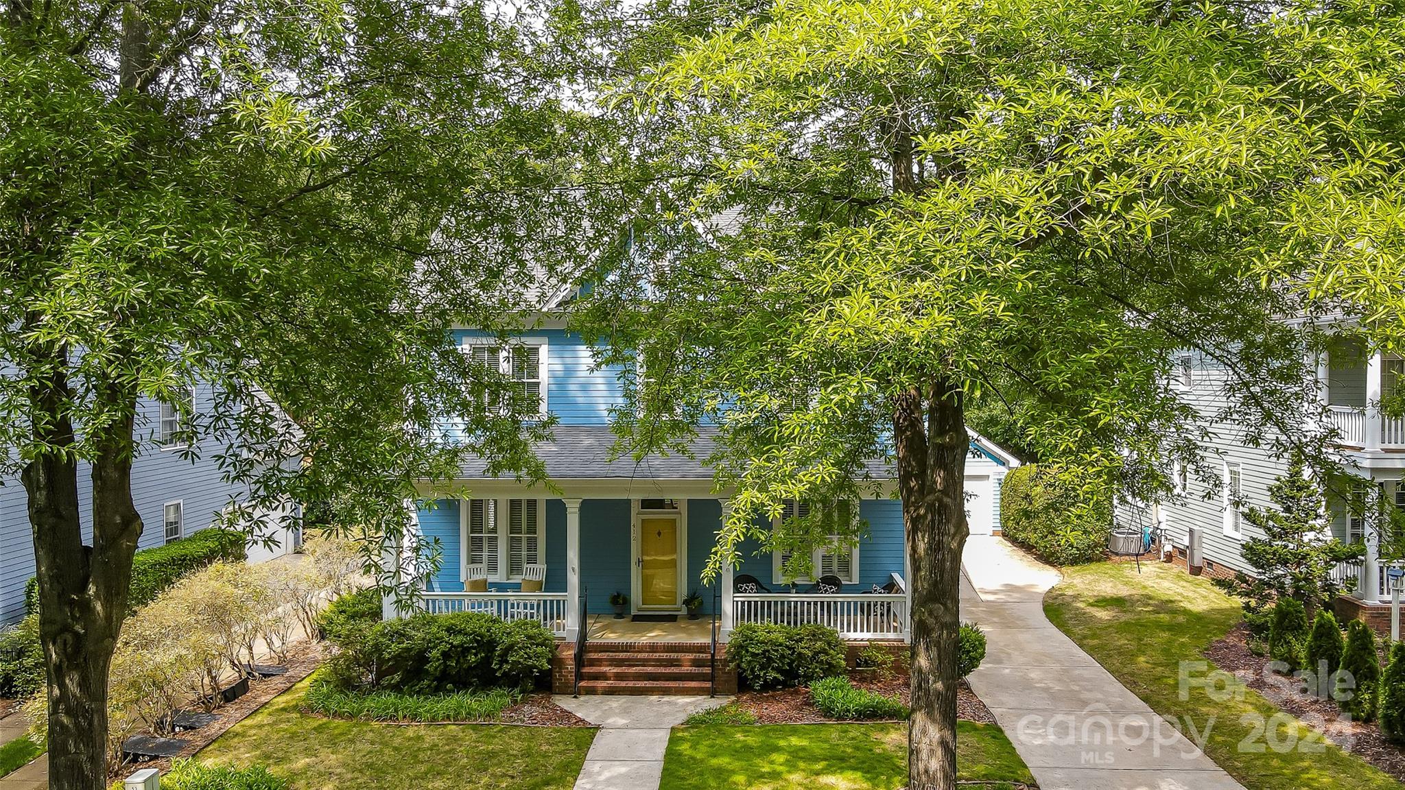 412 Sophia Court Fort Mill, SC 29708 - Photo 33 of 34 a front view of a house with garden