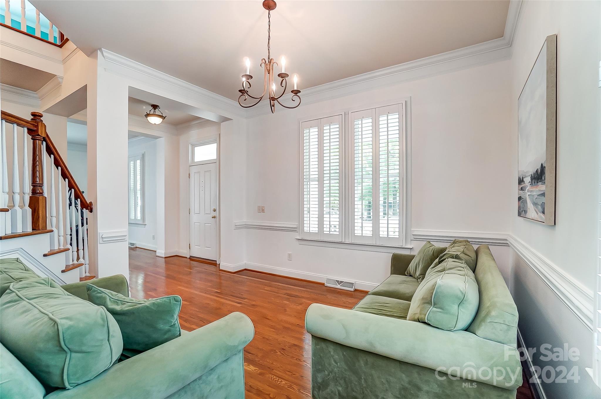 412 Sophia Court Fort Mill, SC 29708 - Photo 5 of 34 a living room with furniture and a chandelier