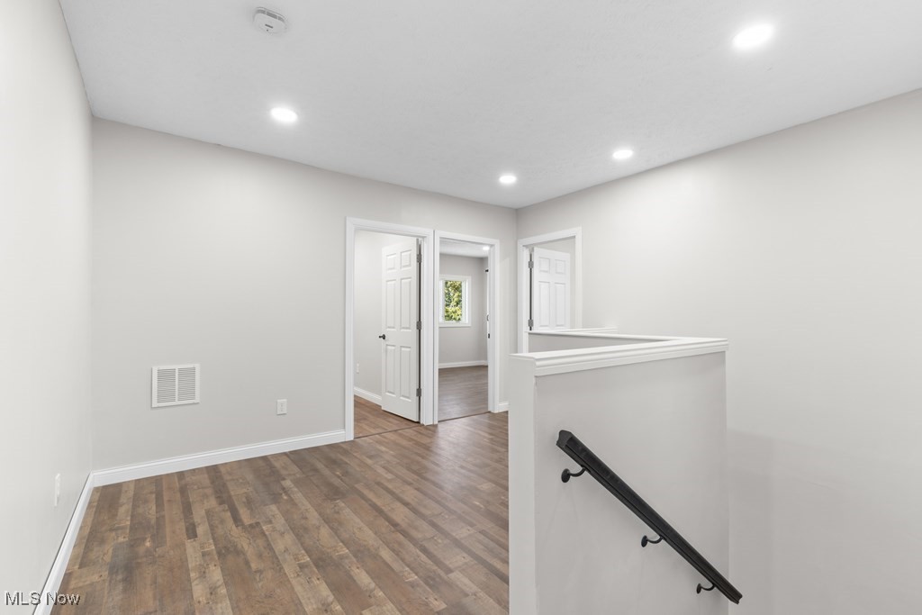 139 Patterson Road Weirton, WV 26062 - Photo 17 of 46 Hall featuring an upstairs landing, dark wood finished floors, and recessed lighting