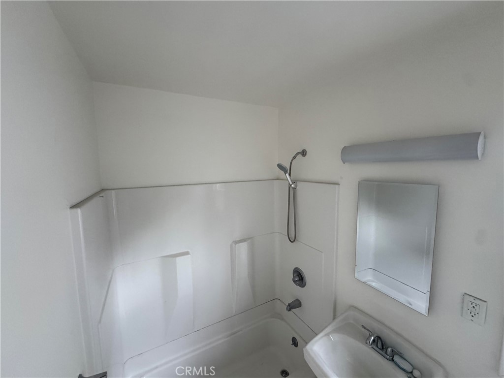 2950 Honolulu Avenue, Unit G Glendale, CA 91214 - Photo 6 of 7 a bathroom with a sink toilet and shower