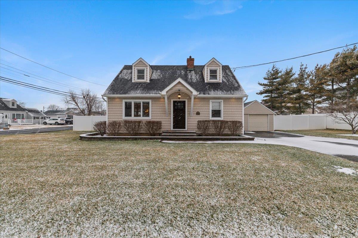 1 Elgin Road Amity Harbor, NY 11701 - Photo 1 of 1 Cape cod home featuring a front yard, and garage