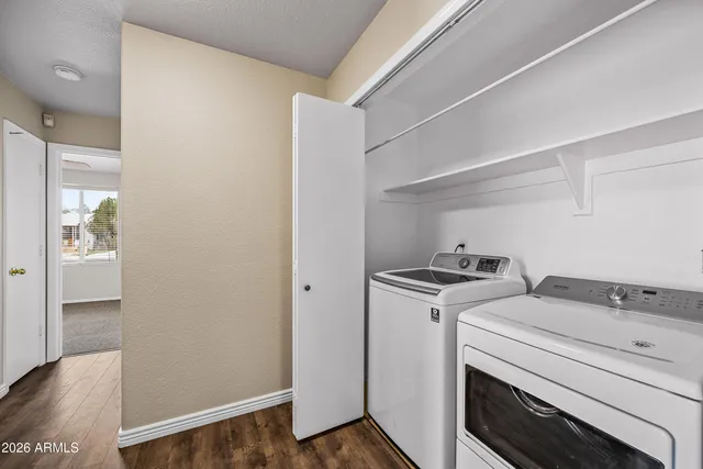 a view of storage and utility room with washer and dryer