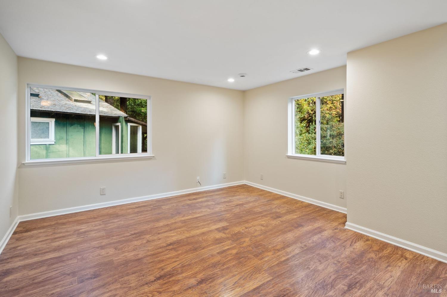 84 Front Street Camp Meeker, CA 95419 - Photo 10 of 24 a view of an empty room with wooden floor and a window