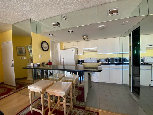 a kitchen with a table and chairs in it