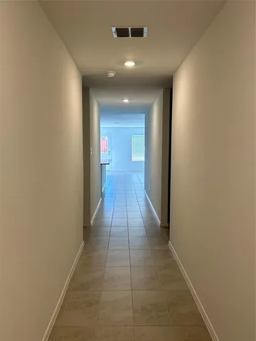 a view of gallery with wooden floor