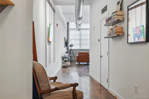 a dining room with furniture and a book shelf