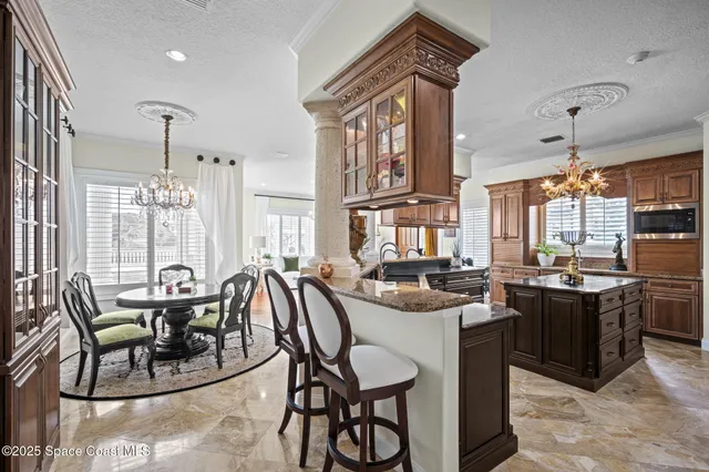 a bathroom with a granite countertop sink a mirror and a window