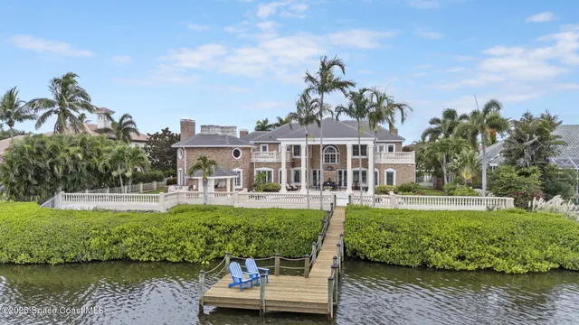 a living room with furniture and a dining table