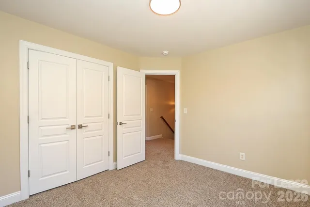a bathroom with a window and a shower