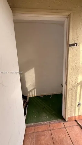 a front view of a house with a garden and patio