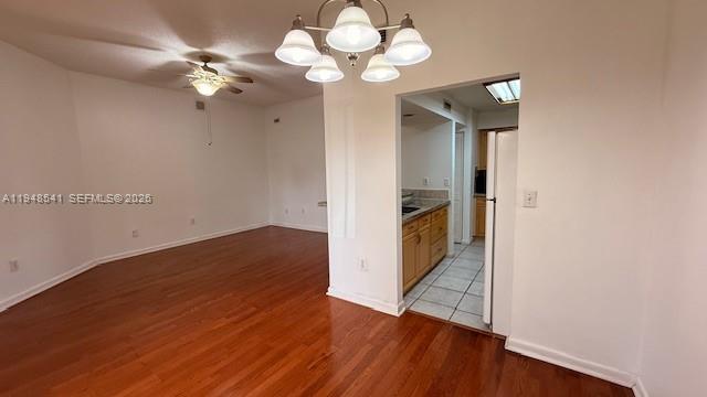 9691 Southwest 138th Avenue, Unit QC2L Miami, FL 33186 - Photo 22 of 48 a view of an empty room with wooden floor
