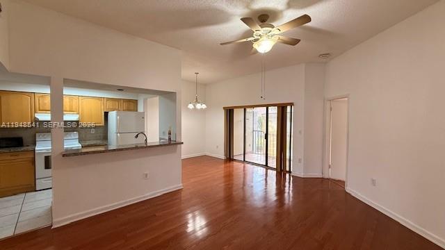 9691 Southwest 138th Avenue, Unit QC2L Miami, FL 33186 - Photo 27 of 48 wooden floor in an empty room with a window