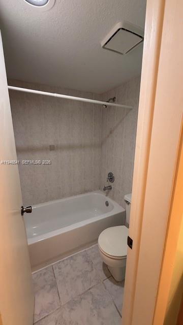 9691 Southwest 138th Avenue, Unit QC2L Miami, FL 33186 - Photo 34 of 48 a bathroom with a toilet and a bathtub