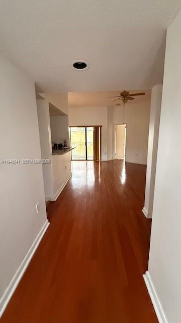 9691 Southwest 138th Avenue, Unit QC2L Miami, FL 33186 - Photo 4 of 48 an empty room with wooden floor and windows