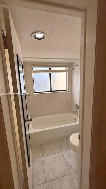 9691 Southwest 138th Avenue, Unit QC2L Miami, FL 33186 - Photo 41 of 48 a bathroom with a tub and a shower