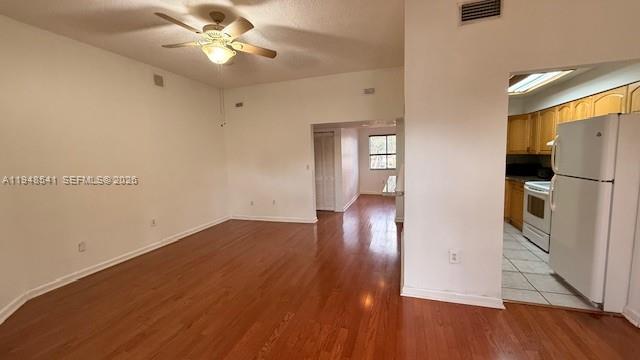9691 Southwest 138th Avenue, Unit QC2L Miami, FL 33186 - Photo 44 of 48 a view of empty room with wooden floor and fan