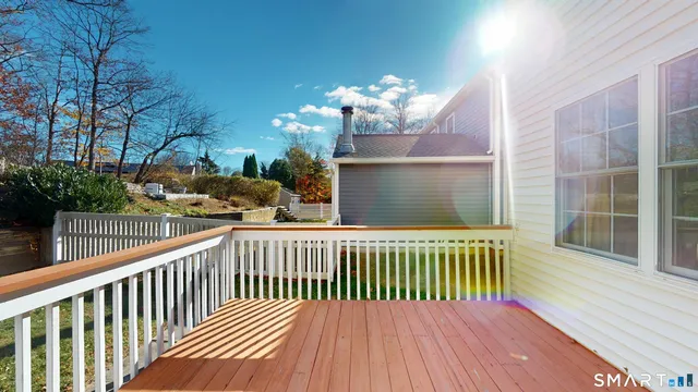 a balcony with view of trees in front of it