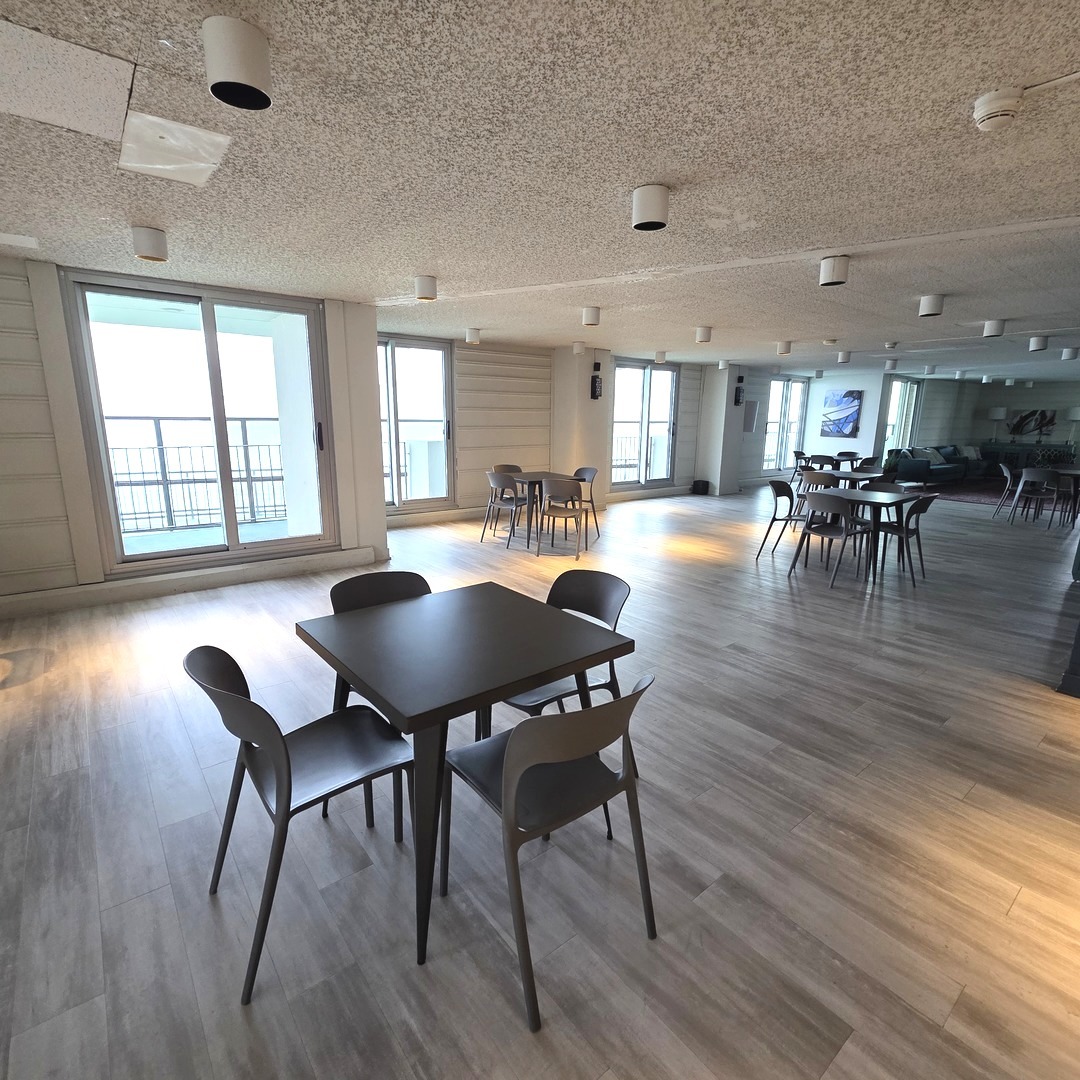 6033 North Sheridan Road, Unit 35F Chicago, IL 60660 - Photo 17 of 26 a view of a dining room with furniture and wooden floor