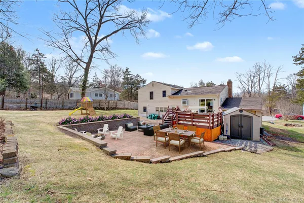 a view of outdoor space with seating area and barbeque oven