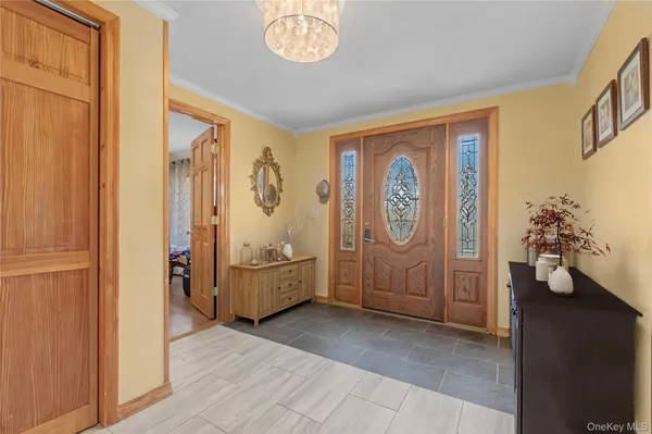 a view of a bedroom with furniture and wooden floor
