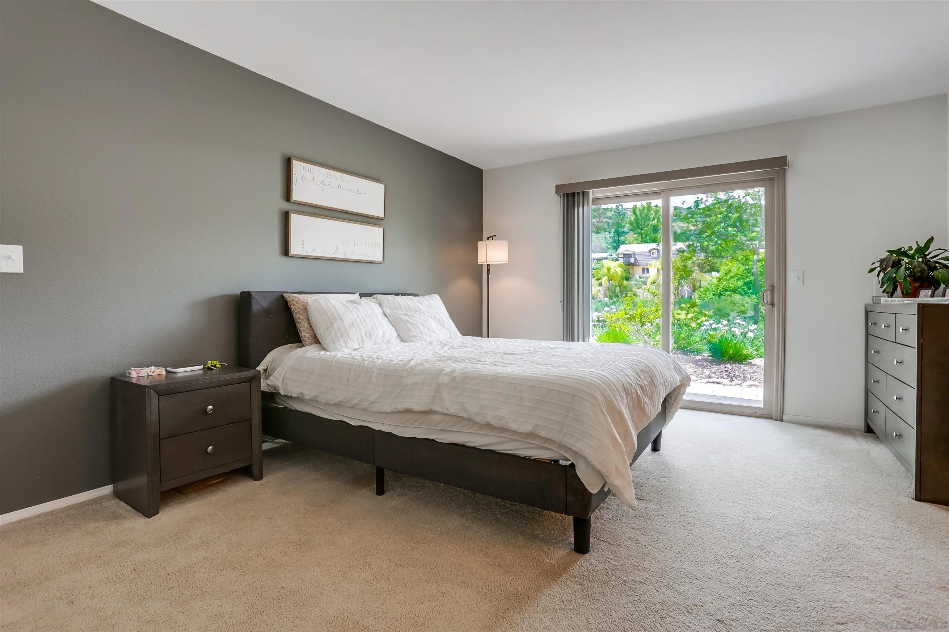 23409 Everett Place Ramona, CA 92065 - Photo 11 of 29 a bedroom with a bed lamp and window
