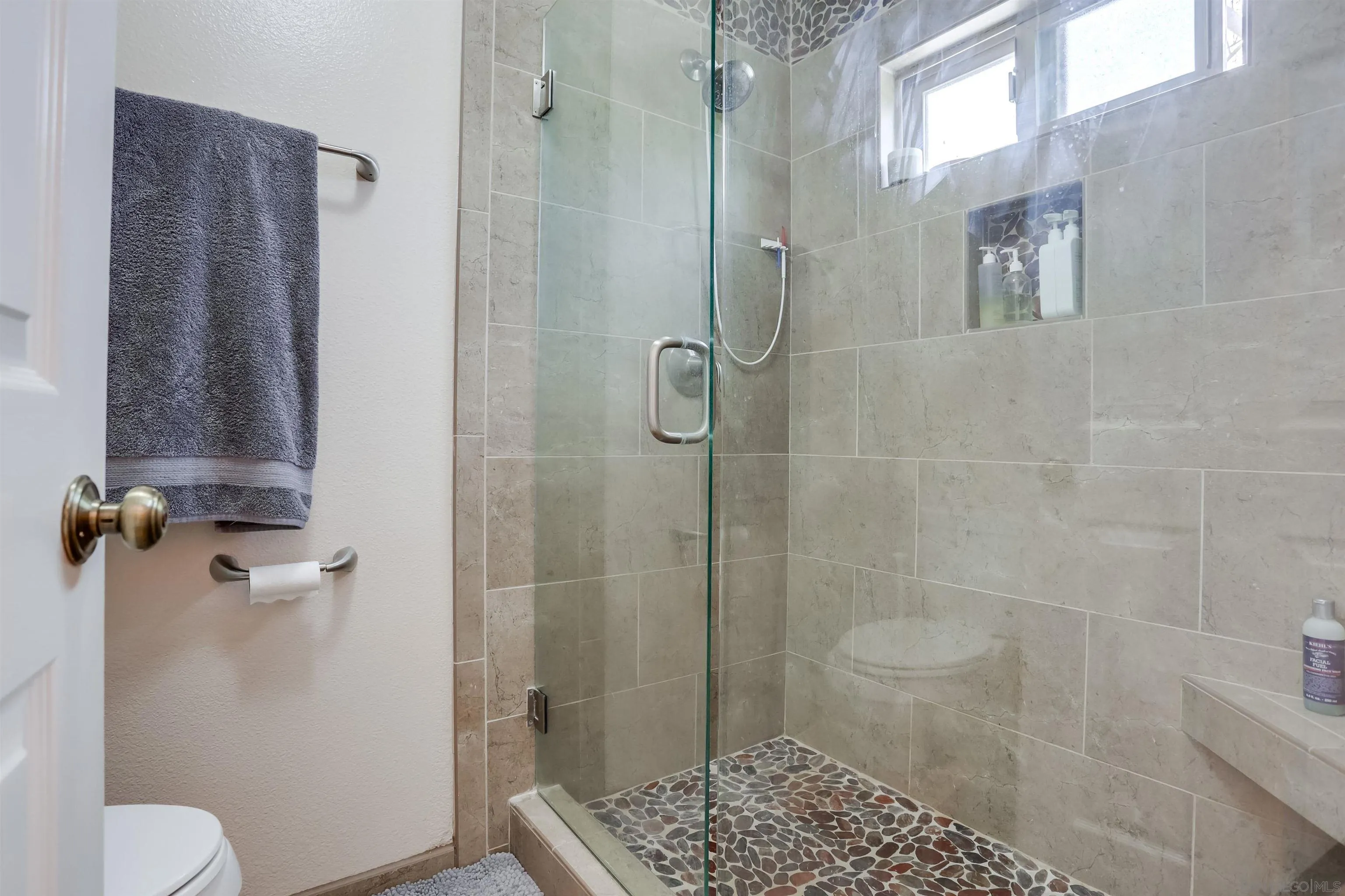 23409 Everett Place Ramona, CA 92065 - Photo 13 of 29 a bathroom with a shower and toilet