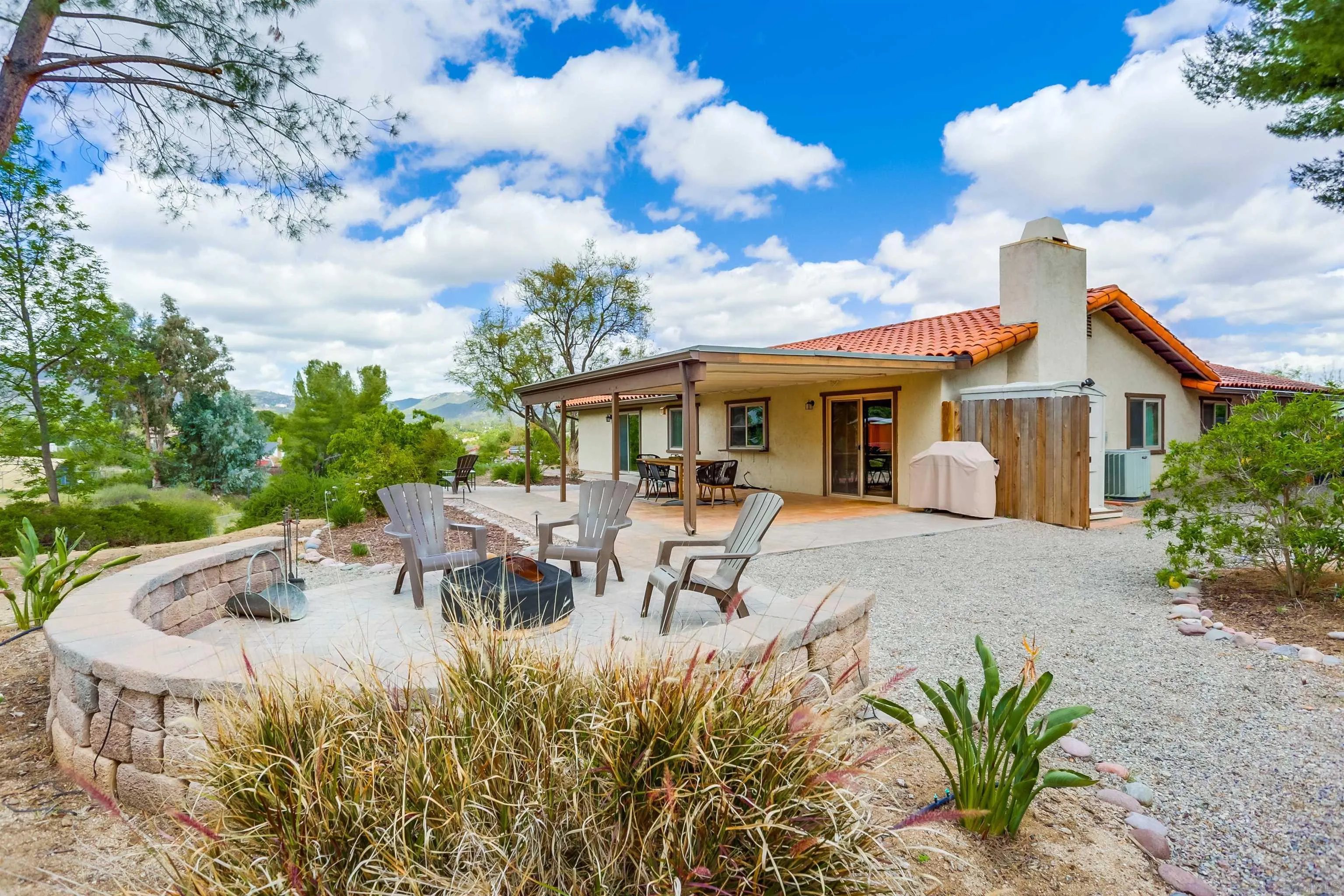 23409 Everett Place Ramona, CA 92065 - Photo 25 of 29 a view of a house with backyard and sitting area