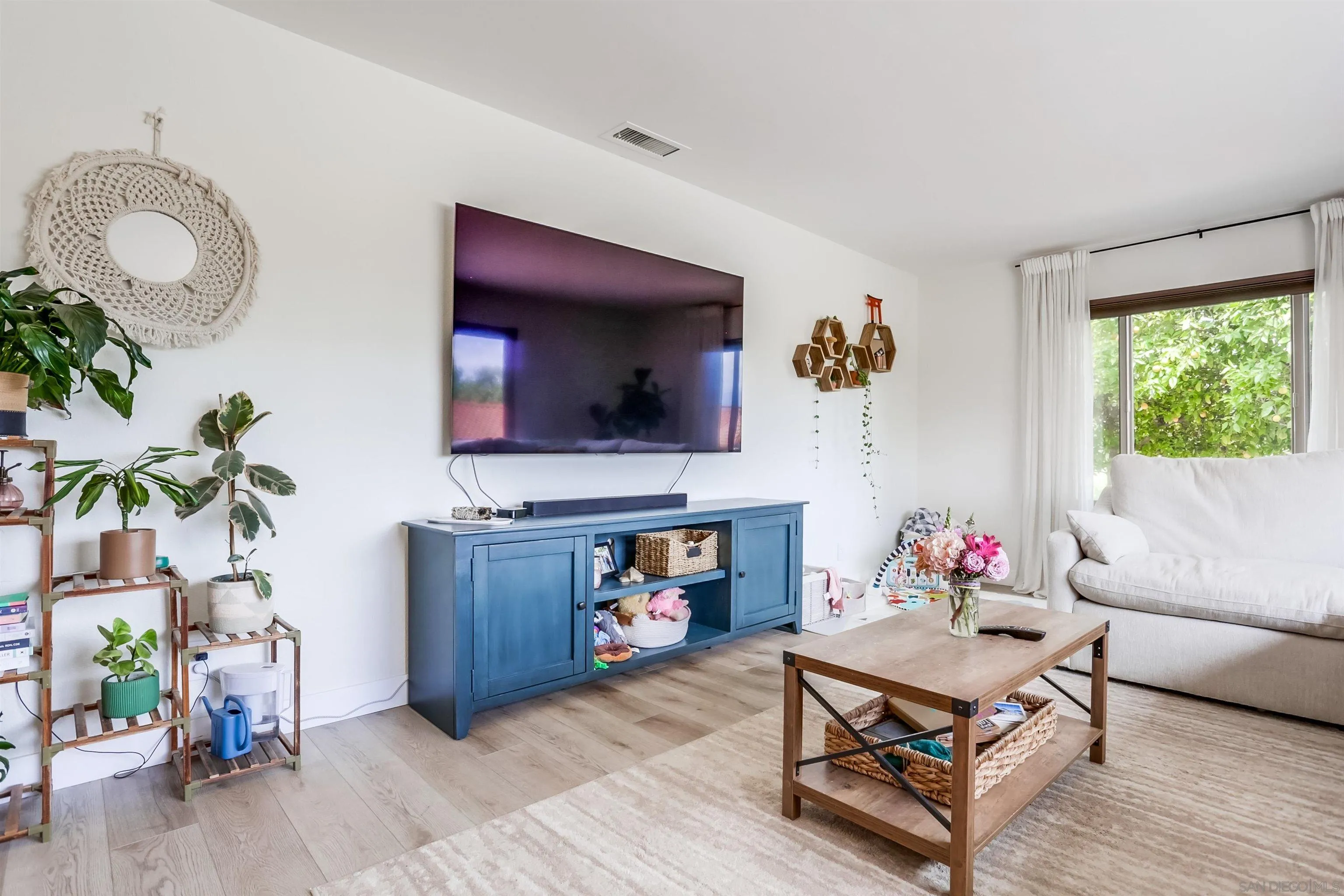 23409 Everett Place Ramona, CA 92065 - Photo 3 of 29 a living room with furniture and a fireplace