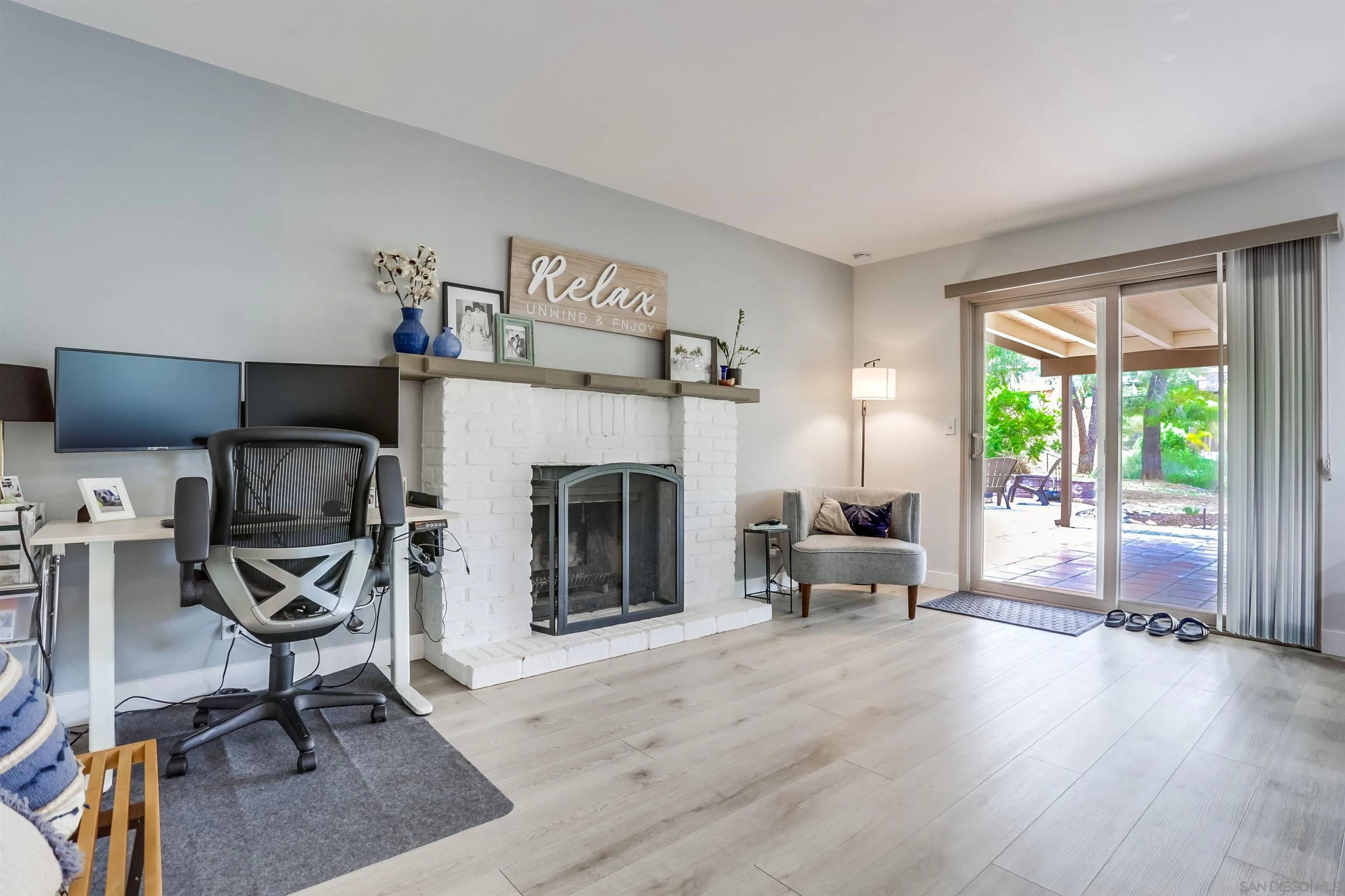 23409 Everett Place Ramona, CA 92065 - Photo 8 of 29 a living room with furniture and a fireplace