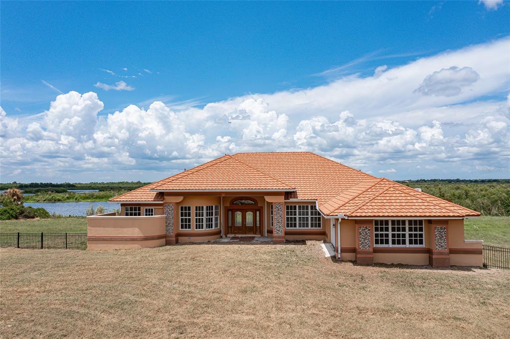 37461 Washington Loop Road Punta Gorda, FL 33982 - Photo 1 of 1 a front view of house with yard and entertaining space